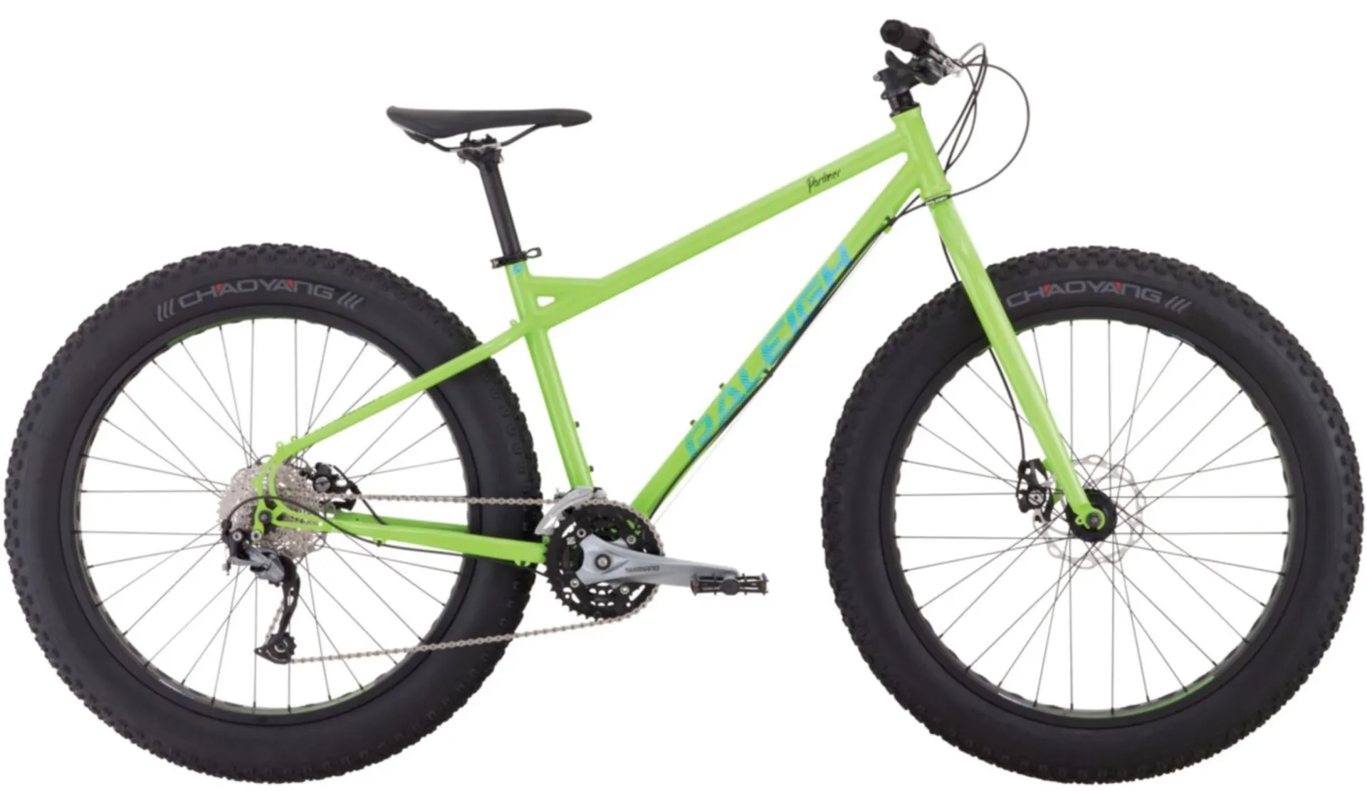 A green bicycle with large tires
